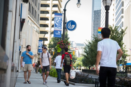 14-0070 Welcome Signage with students in front of AYSPS.